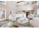 Inviting living room features vaulted ceilings, lots of natural light, and stylish furnishings at 3167 Bay View Dr, Jonesboro, GA 30236