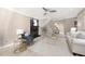 Spacious living room with fireplace, ceiling fan and a light neutral color palette at 3167 Bay View Dr, Jonesboro, GA 30236