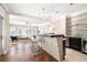 Well-designed living area with stone accent bar, hardwood floors, and plenty of natural light at 3167 Bay View Dr, Jonesboro, GA 30236