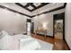 Spacious main bedroom with hardwood flooring, coffered ceiling and entry to the personal bathroom at 3167 Bay View Dr, Jonesboro, GA 30236