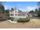 Stunning back exterior view with a white staircase and a beautiful wooden deck at 3167 Bay View Dr, Jonesboro, GA 30236