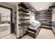 Spacious walk-in closet with custom shelves and dark wood trim at 3167 Bay View Dr, Jonesboro, GA 30236