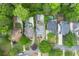 Stunning aerial view of several homes with private pools nestled among lush greenery, offering a serene and private setting at 4005 N Stratford Ne Rd, Atlanta, GA 30342