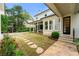 Charming backyard with a covered patio, stepping stones, and lush landscaping at 4005 N Stratford Ne Rd, Atlanta, GA 30342
