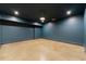 Unfinished basement space with concrete floors and dark walls at 4005 N Stratford Ne Rd, Atlanta, GA 30342