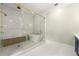 This modern bathroom features a glass enclosed shower, free standing tub, blue cabinets and tile floors at 4005 N Stratford Ne Rd, Atlanta, GA 30342
