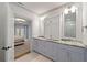 Bathroom featuring double sinks, marble countertops, cabinets, and an open view to the main bedroom at 4005 N Stratford Ne Rd, Atlanta, GA 30342