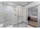 Bathroom with an elegant glass shower with white tile, marble floors, and stylish fixtures at 4005 N Stratford Ne Rd, Atlanta, GA 30342