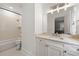 Modern bathroom with shower-tub and long vanity with lots of counter space at 4005 N Stratford Ne Rd, Atlanta, GA 30342