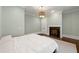 Light-filled bedroom with a decorative fireplace, light-blue walls, and modern lighting at 4005 N Stratford Ne Rd, Atlanta, GA 30342