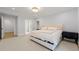 Well-lit bedroom with a queen bed, modern furniture, and access to an ensuite bathroom at 4005 N Stratford Ne Rd, Atlanta, GA 30342