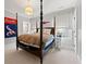 Inviting bedroom with four-poster bed, neutral tones, and sports team decor at 4005 N Stratford Ne Rd, Atlanta, GA 30342
