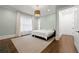 Light-filled bedroom with soothing light-blue walls, carpet and modern lighting at 4005 N Stratford Ne Rd, Atlanta, GA 30342
