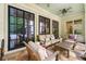 Relaxing covered patio with comfortable seating, stone flooring and lots of natural light at 4005 N Stratford Ne Rd, Atlanta, GA 30342