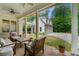 Cozy covered patio area with comfortable seating, stone flooring, and backyard views at 4005 N Stratford Ne Rd, Atlanta, GA 30342