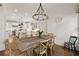 Bright dining room showcasing an antique table, wooden chairs, and an open view to the kitchen at 4005 N Stratford Ne Rd, Atlanta, GA 30342