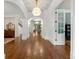 Grand foyer with soaring ceilings, hardwood floors, and elegant lighting fixtures at 4005 N Stratford Ne Rd, Atlanta, GA 30342