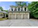 Exterior showcasing the detached three-car garage with a beautiful driveway at 4005 N Stratford Ne Rd, Atlanta, GA 30342