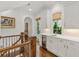 Hallway with wet bar, beverage fridge, and built in cabinets at 4005 N Stratford Ne Rd, Atlanta, GA 30342