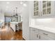 Modern kitchen featuring white cabinets, stainless steel appliances, and a center island at 4005 N Stratford Ne Rd, Atlanta, GA 30342