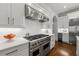 Gourmet kitchen featuring white cabinets, stainless steel appliances, and a professional-grade Viking range at 4005 N Stratford Ne Rd, Atlanta, GA 30342