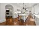 Open-concept kitchen with island seating and flow into the adjacent living area at 4005 N Stratford Ne Rd, Atlanta, GA 30342