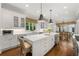 Bright and open kitchen with white cabinetry, quartz countertops, and a large center island at 4005 N Stratford Ne Rd, Atlanta, GA 30342
