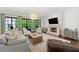 Inviting living room with a cozy fireplace, backyard views, and comfortable furniture at 4005 N Stratford Ne Rd, Atlanta, GA 30342