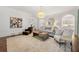 Bright living room featuring a decorative area rug, stylish furniture, and modern lighting at 4005 N Stratford Ne Rd, Atlanta, GA 30342