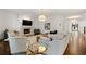Open living room featuring hardwood floors, fireplace, neutral decor, and lots of natural light at 4005 N Stratford Ne Rd, Atlanta, GA 30342