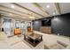 Inviting living room featuring exposed beam ceiling, modern lighting, and comfortable seating arrangement at 4005 N Stratford Ne Rd, Atlanta, GA 30342
