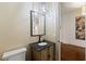 Stylish powder room featuring decorative wallpaper, stone countertop, and modern light fixtures at 4005 N Stratford Ne Rd, Atlanta, GA 30342