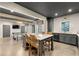 Open-concept kitchen featuring gray cabinets, stainless steel appliances, and a marble-topped island with seating at 4005 N Stratford Ne Rd, Atlanta, GA 30342