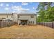 Expansive backyard featuring a covered patio, great for gatherings in a private, fenced-in area at 821 Ethereow Ct, Lawrenceville, GA 30046