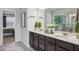 Bathroom featuring double vanity, granite countertops, and walk-in shower, designed for comfort and luxury at 821 Ethereow Ct, Lawrenceville, GA 30046