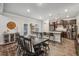 Open concept dining area with an island, stainless steel appliances, and modern lighting at 821 Ethereow Ct, Lawrenceville, GA 30046