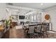 Dining room with hardwood floors and decorative molding that connects to the living area at 821 Ethereow Ct, Lawrenceville, GA 30046