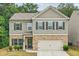 Charming two-story home with a brick and siding exterior and a two car garage at 821 Ethereow Ct, Lawrenceville, GA 30046