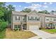 Well-maintained two-story home with a two-car garage and manicured lawn at 821 Ethereow Ct, Lawrenceville, GA 30046
