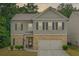 Charming two-story home with well-maintained landscaping, a brick facade, and a welcoming entrance at 821 Ethereow Ct, Lawrenceville, GA 30046