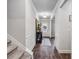 Elegant hallway with wainscoting, hardwood floors, decor, and a view of the front door at 821 Ethereow Ct, Lawrenceville, GA 30046