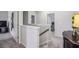 Upstairs hallway with carpeted floors and neutral paint, connecting the various rooms of the home at 821 Ethereow Ct, Lawrenceville, GA 30046