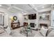 Cozy living room with a fireplace, coffered ceiling, comfortable seating, and stylish decor at 821 Ethereow Ct, Lawrenceville, GA 30046
