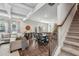 Open-concept living room and dining area boasts coffered ceilings, hardwood floors, and ample natural light at 821 Ethereow Ct, Lawrenceville, GA 30046
