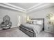 Cozy main bedroom with a decorative tray ceiling and neutral decor, creating a relaxing retreat at 821 Ethereow Ct, Lawrenceville, GA 30046