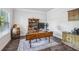 Bright home office with a large window and a spacious work area at 821 Ethereow Ct, Lawrenceville, GA 30046