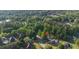 Scenic aerial view of property surrounded by lush trees in a residential neighborhood at 120 Julia Ct, Fayetteville, GA 30214