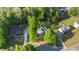 Expansive aerial view of a home surrounded by lush greenery and mature trees in a residential neighborhood at 120 Julia Ct, Fayetteville, GA 30214