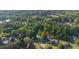 Enjoy the peace of this neighborhood, surrounded by lush forestry and calm waters in this aerial view at 120 Julia Ct, Fayetteville, GA 30214