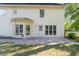 Back patio with an outdoor area and house exterior with nice windows at 120 Julia Ct, Fayetteville, GA 30214